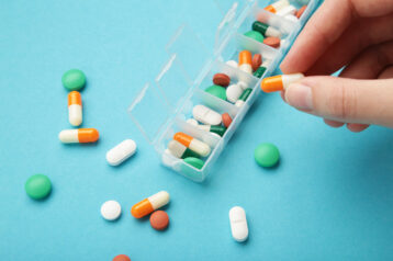 Closeup Of Sorting Pills In Pillbox